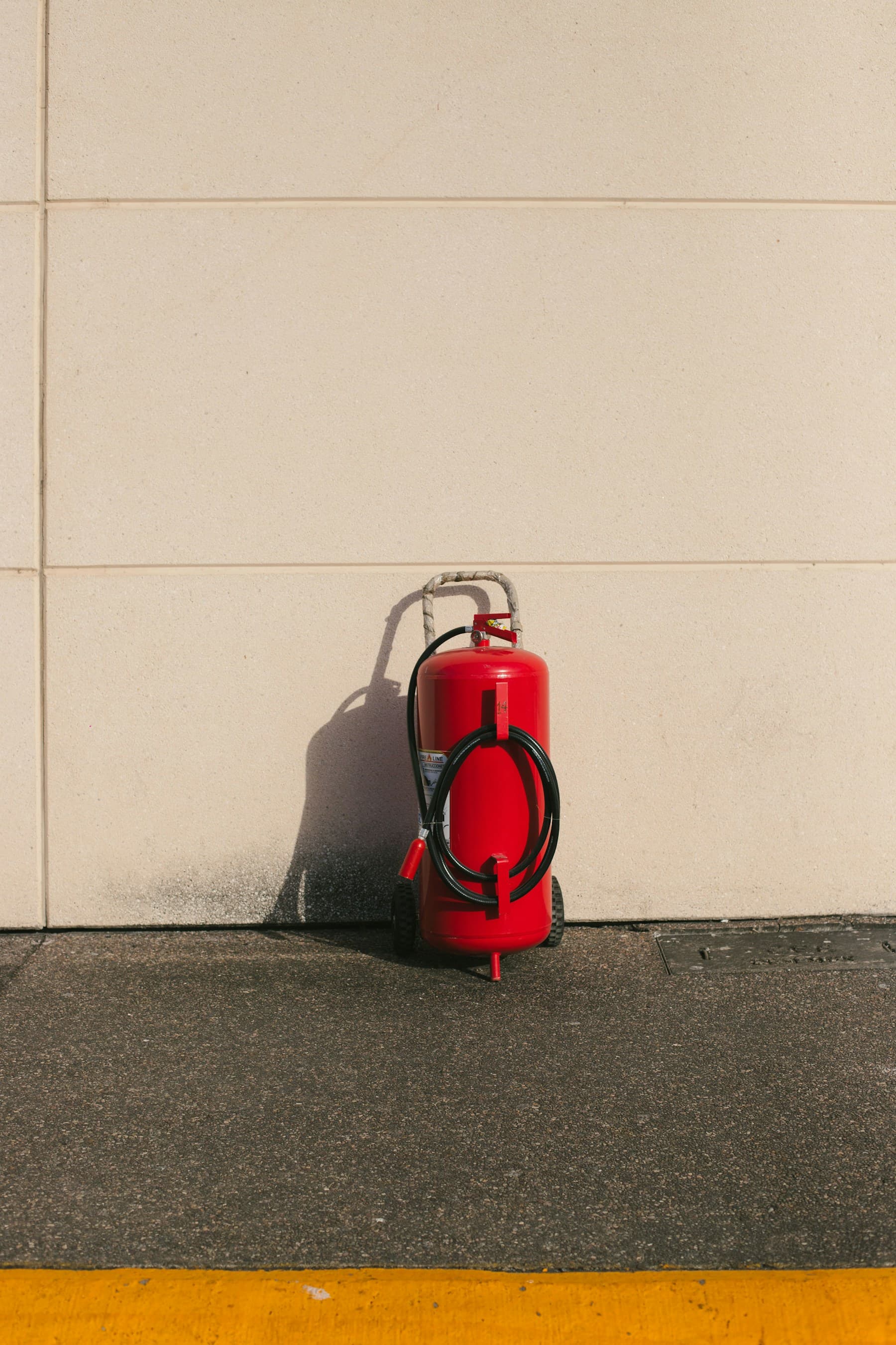 Red fire extinguisher ready for use